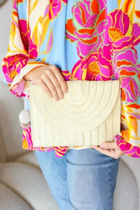 Raffia Flap Closure Clutch Bag with Wrist Strap and Pom Pom