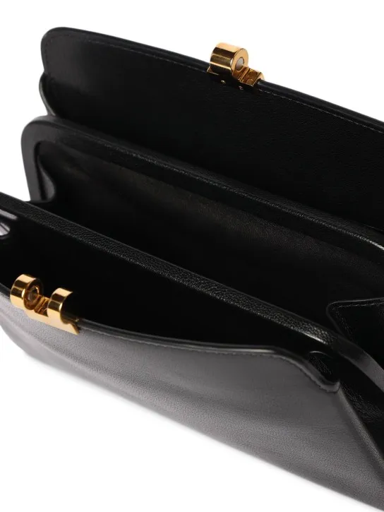 The Row   Amazon shiny kid leather clutch 